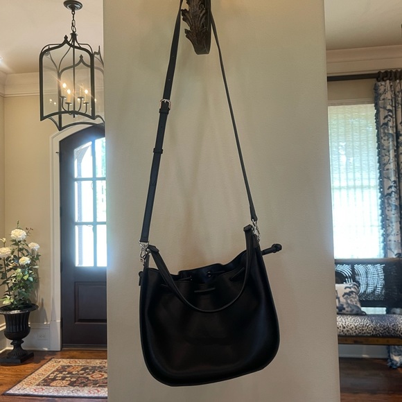 Black leather drawstring Oryany drawstring bucket bag. - Picture 1 of 15